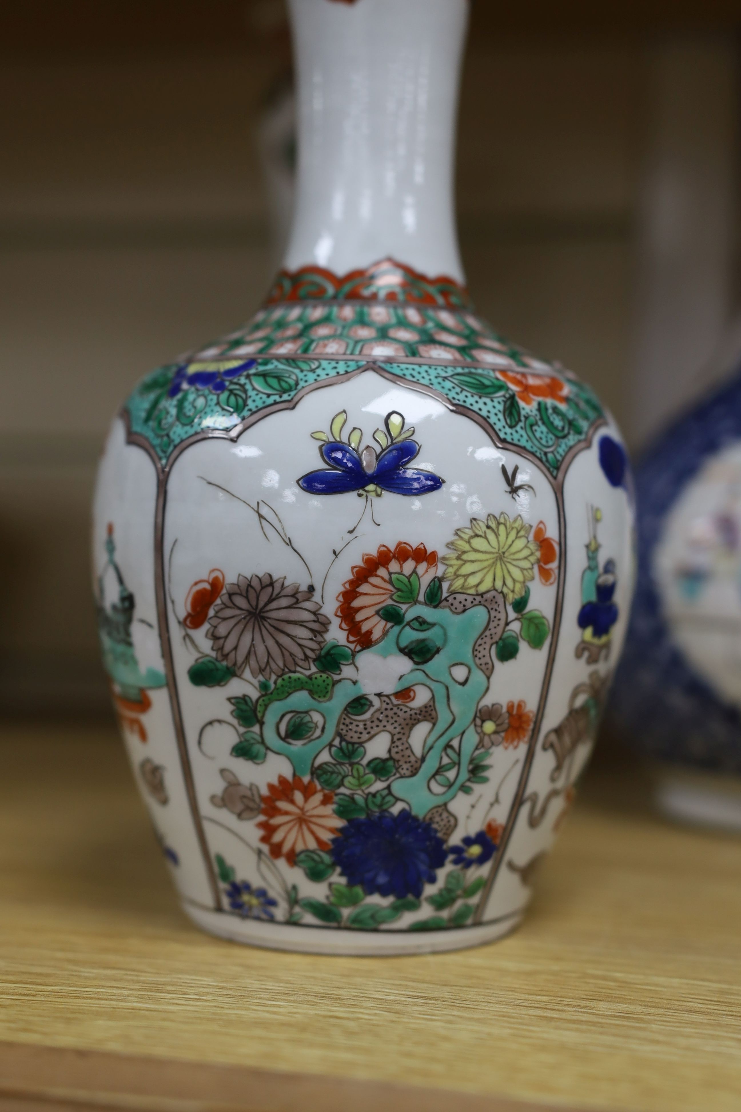 A pair Samson of Paris vases in the Chinese famille verte style and a Chinese Qianlong famille rose garlic neck vase with blue panelling motif, tallest 26cm